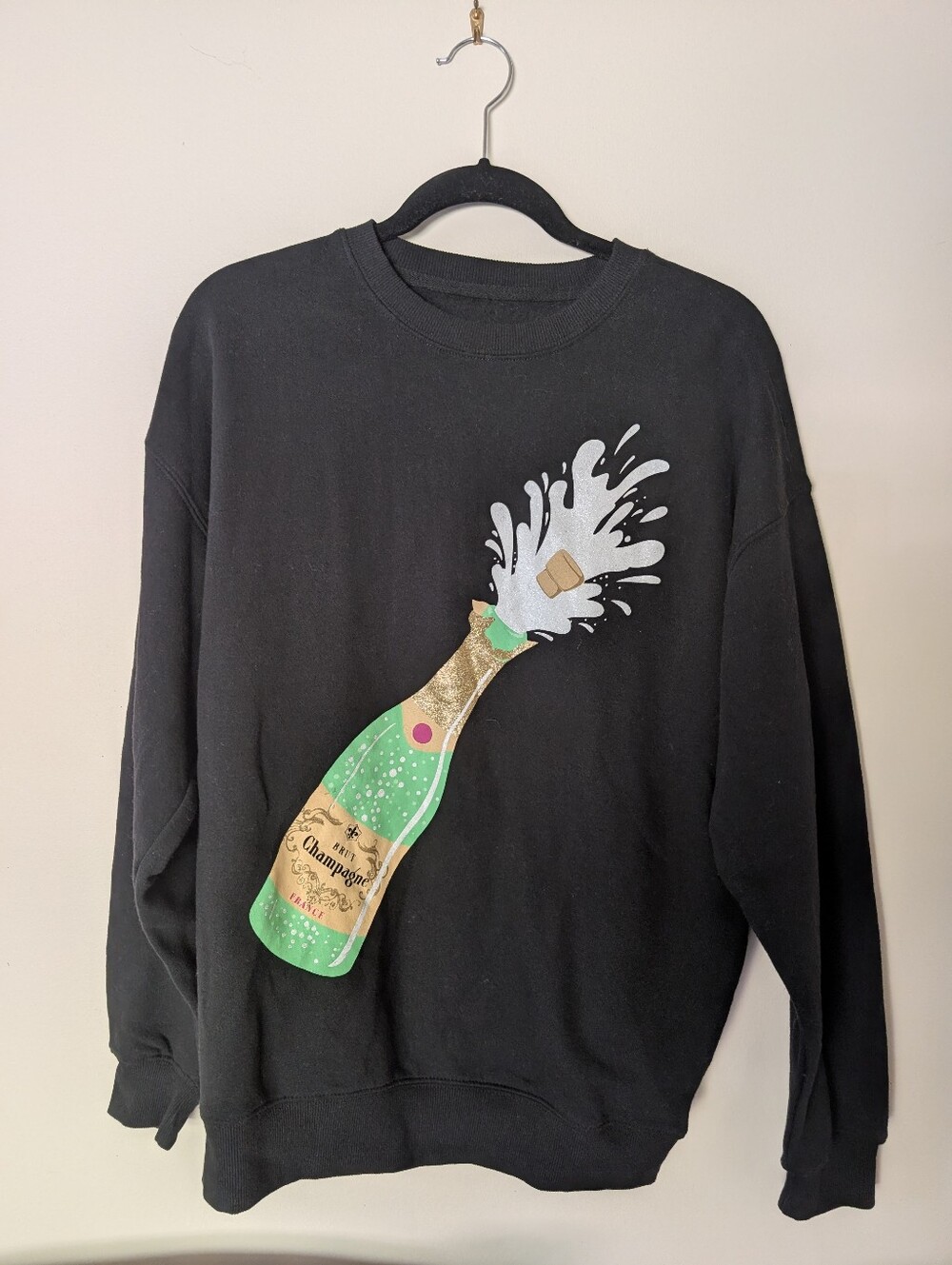 NWOT Goodie Two Sleeves Black Sweatshirt with Champagne Bottle Graphic
